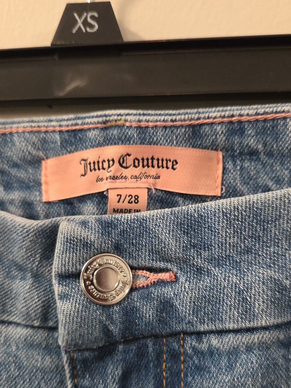 Light-wash denim shorts by Juicy Couture featuring a classic mid-rise - Picture 2 of 5